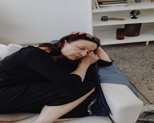 Person resting with a comfortable posture in a living room