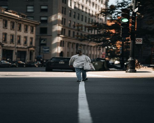 Person walking comfortably on a city street